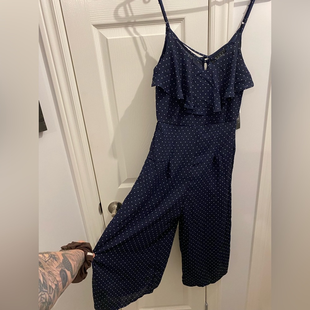 Trixxi ruffled neck romper in navy Polka dots